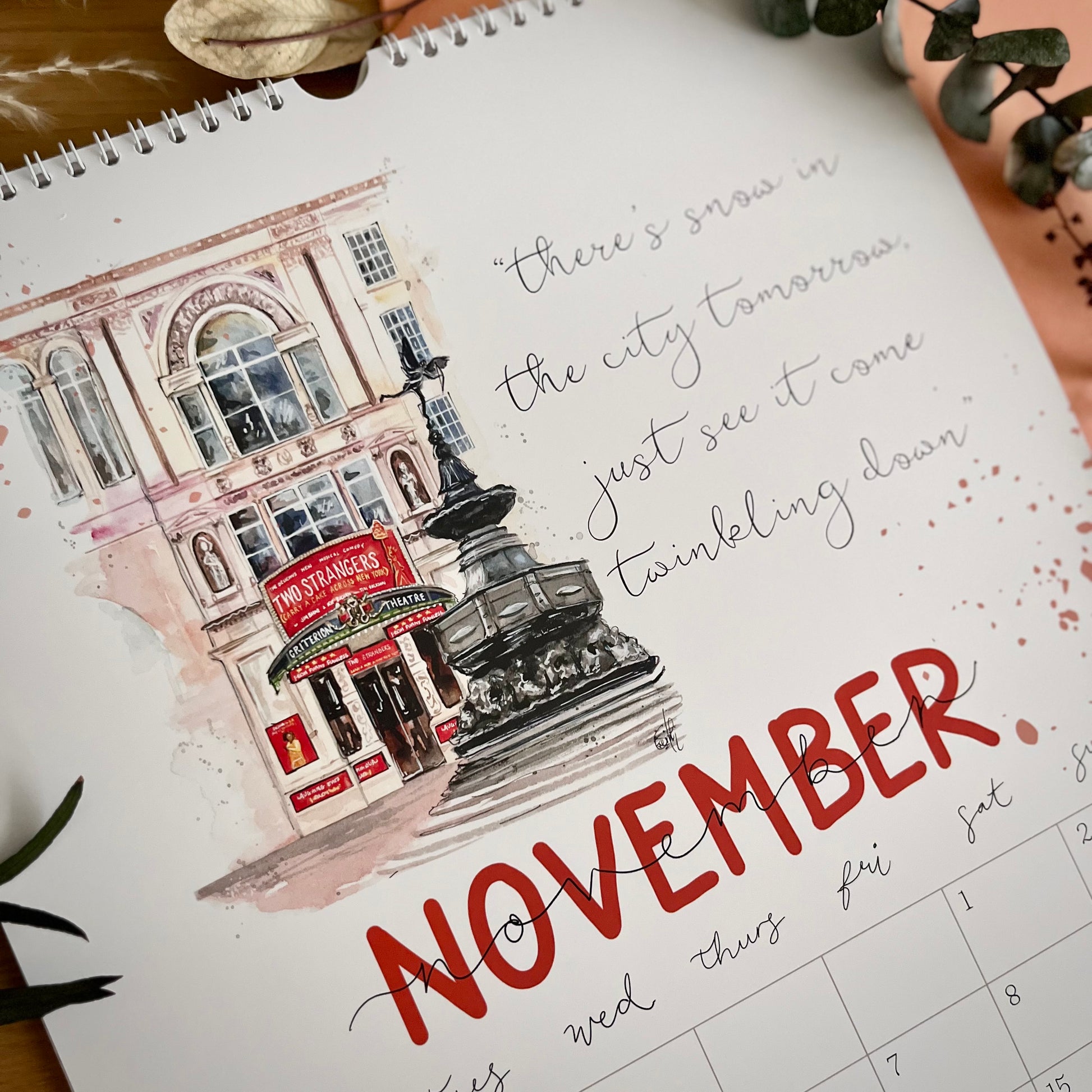 A photo of the November page for Eve Leoni Art’s 2025 West End Musical Theatre calendars, featuring an illustration of the Criterion Theatre with  the Two Strangers musical. 