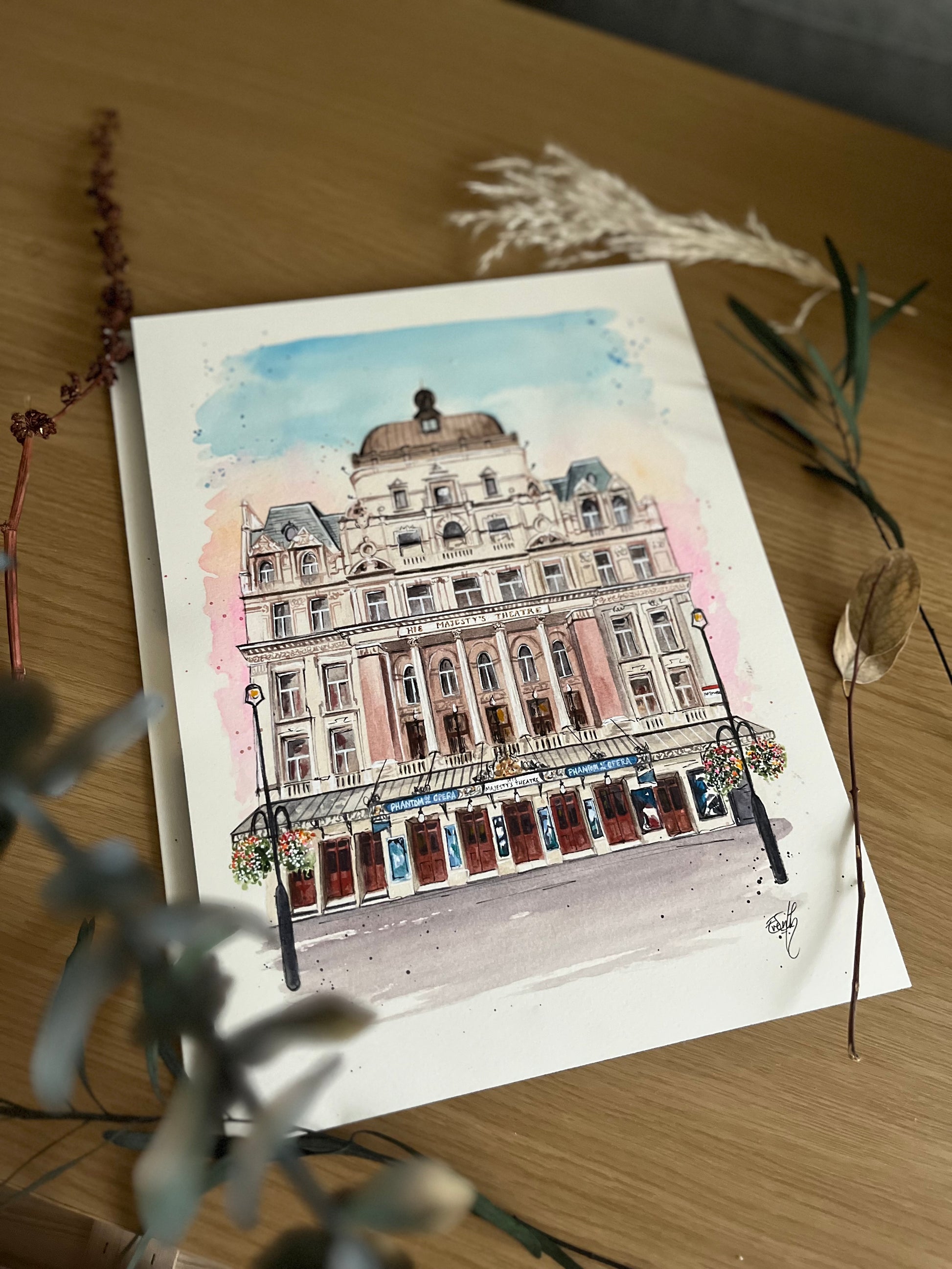 An original painting of His Majesty’s Theatre in London, home to Phantom of the Opera the West End Musical and painted by London artist, Eve Leoni Smith. 