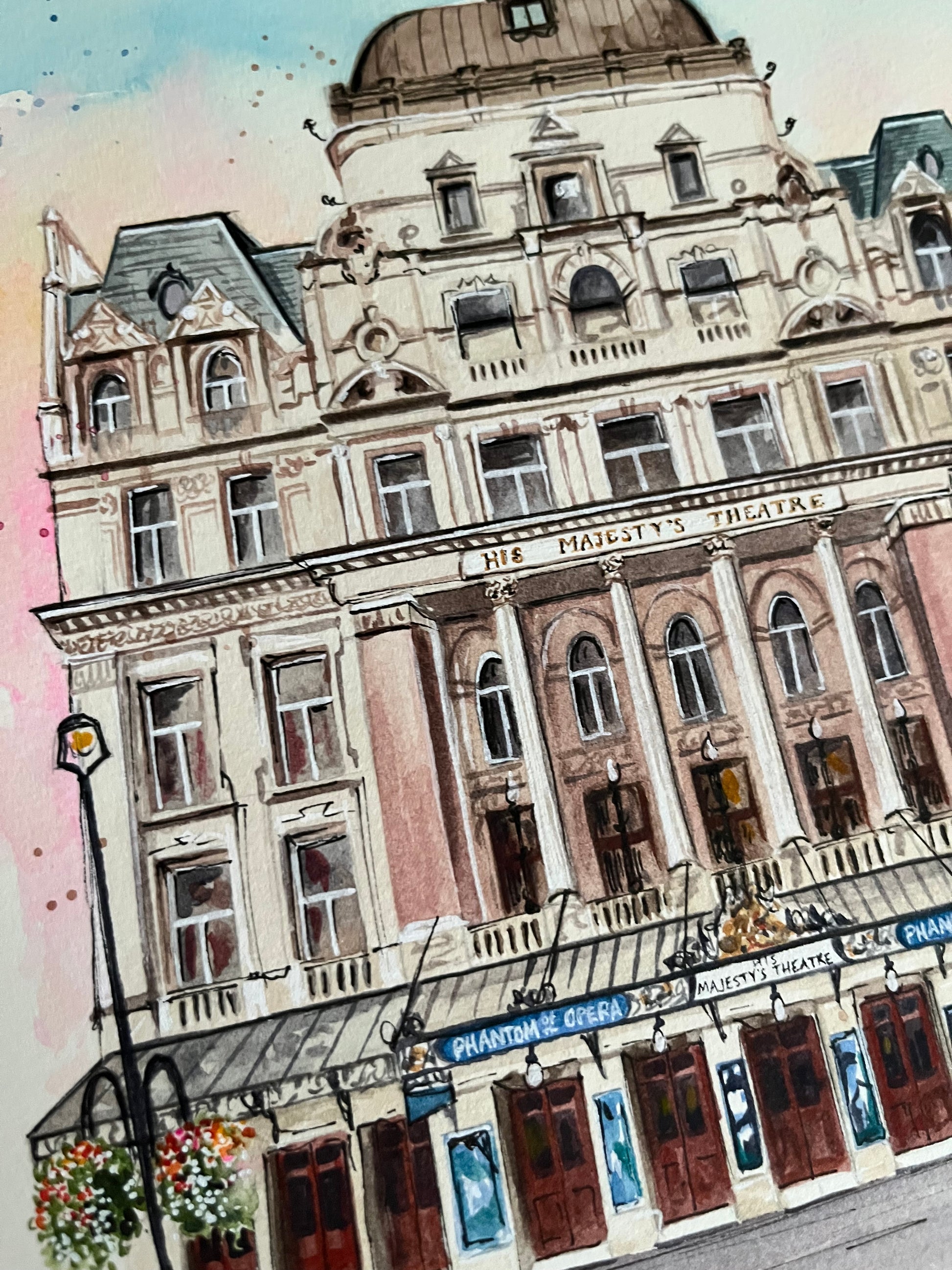 A close up shot of the details on Eve Leoni Smith’s watercolour painting of Phantom of the Opera at His Majesty’s Theatre in Londo: West End. 