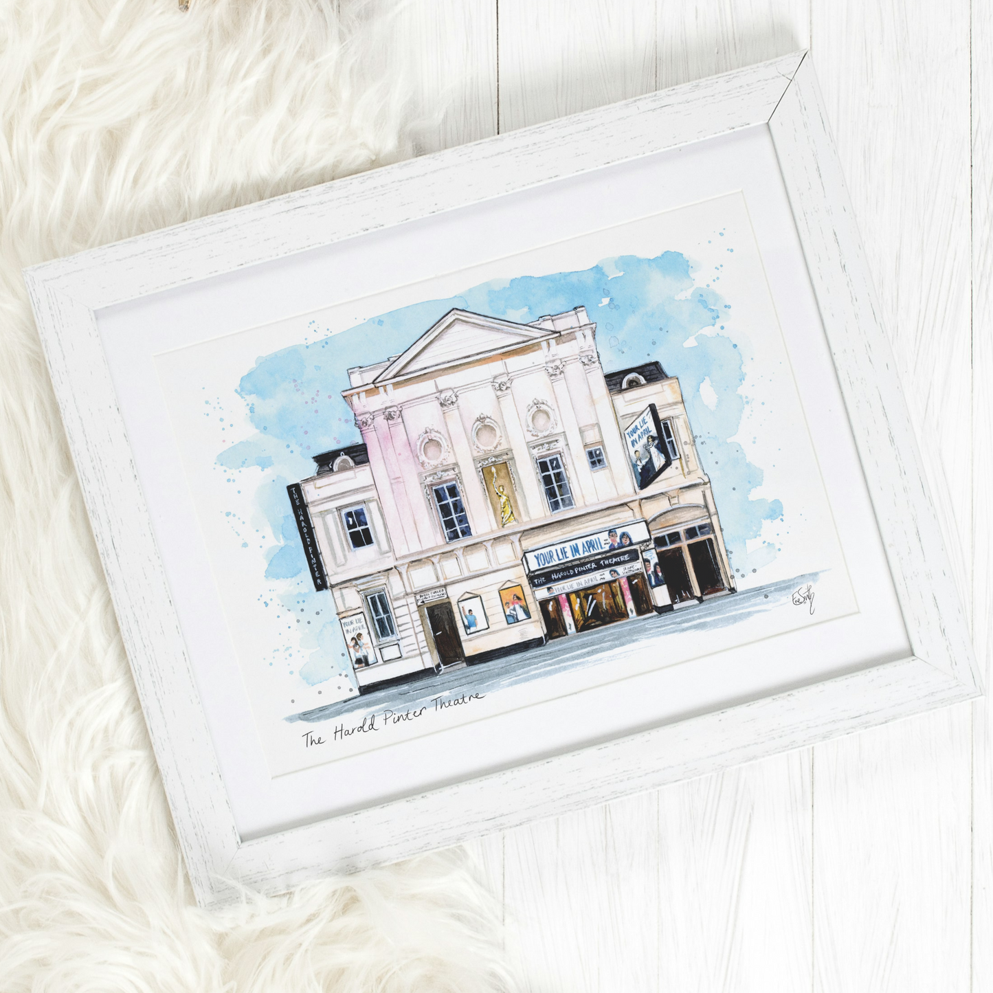 An original watercolour painting of the Harold Pinter Theatre in the West End, featuring Your Lie in April the Musical. 