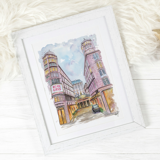 A framed watercolour painting of the Savoy Theatre and Hotel in London's West End, featuring the Mean Girls Musical, painted by local artist and performer, Eve Leoni Smith.